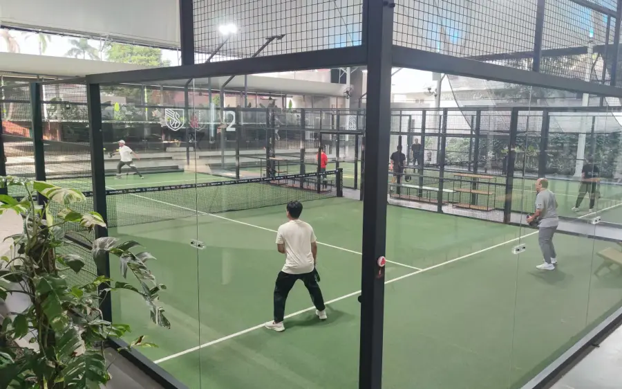 Players on a glass-walled court